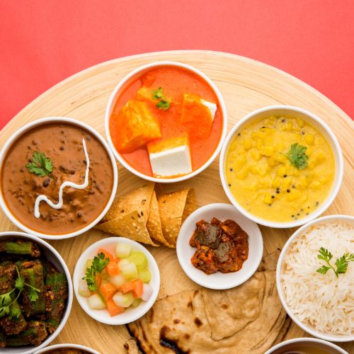 A traditional indian thali with various vegeterian dishes