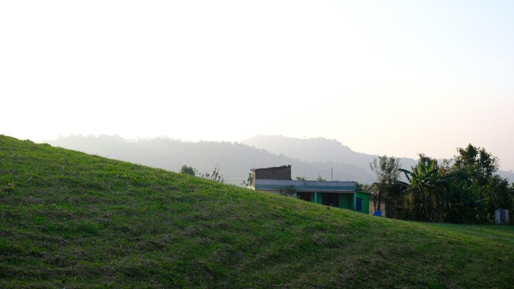 Tranquil resort garden surrounded by Sahyadri mountain fog in Igatpuri