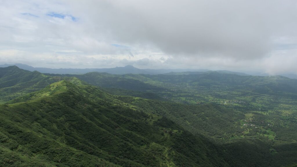 Trekkers climbing the steep rock-cut stairs of Harihar Fort near Igatpuri