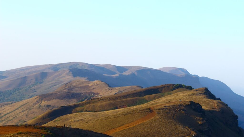 Scenic view of Tringalwadi Fort ruins and surrounding mountains in Igatpuri