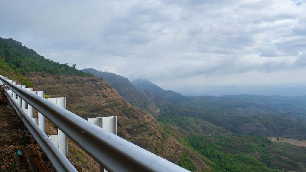 Scenic highway drive through misty Sahyadri mountains towards Igatpuri